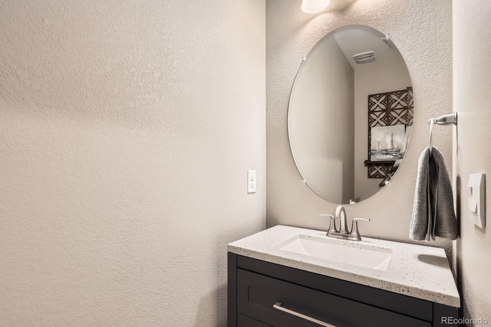 1591 Sun River Road Berthoud, CO 80513 - Photo 18 of 34 a bathroom with a sink and a mirror