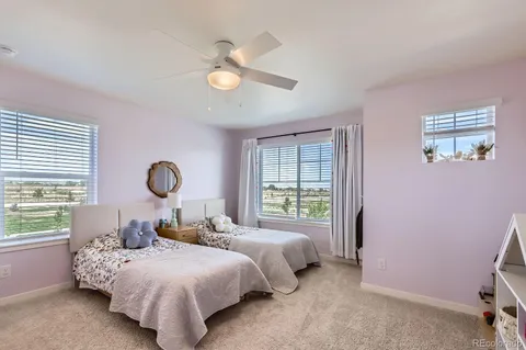 a bedroom with bed and a window