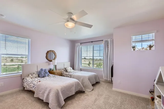 a bedroom with bed and a window