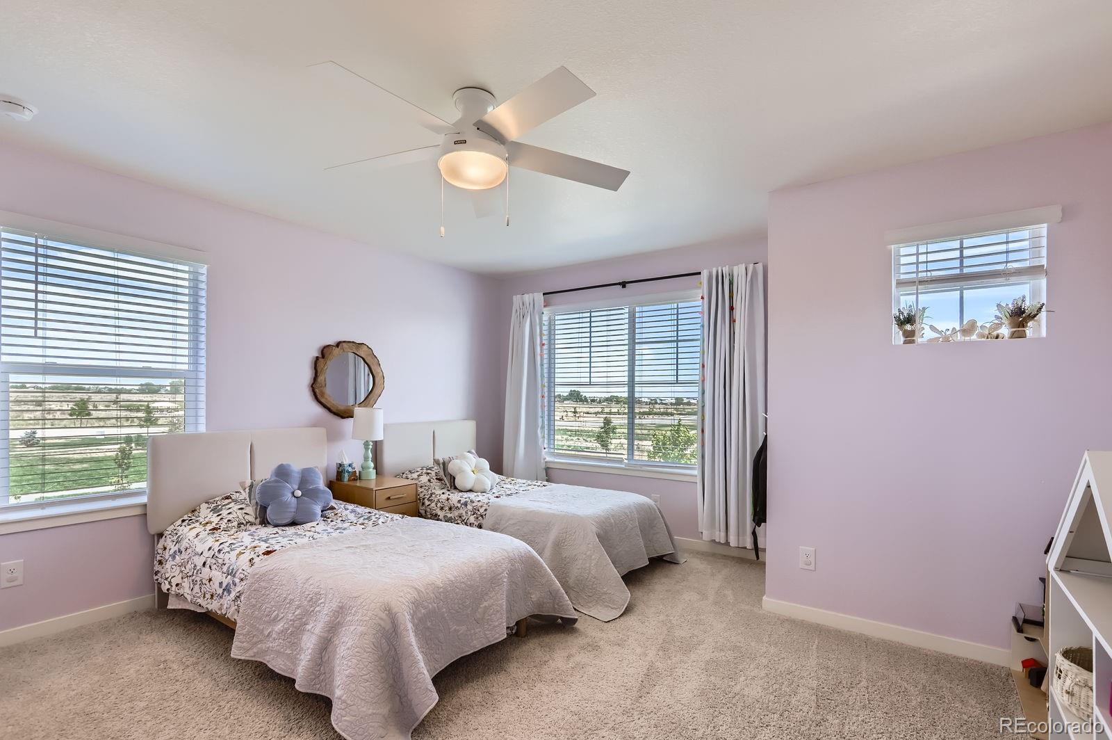 1591 Sun River Road Berthoud, CO 80513 - Photo 24 of 34 a bedroom with bed and a window