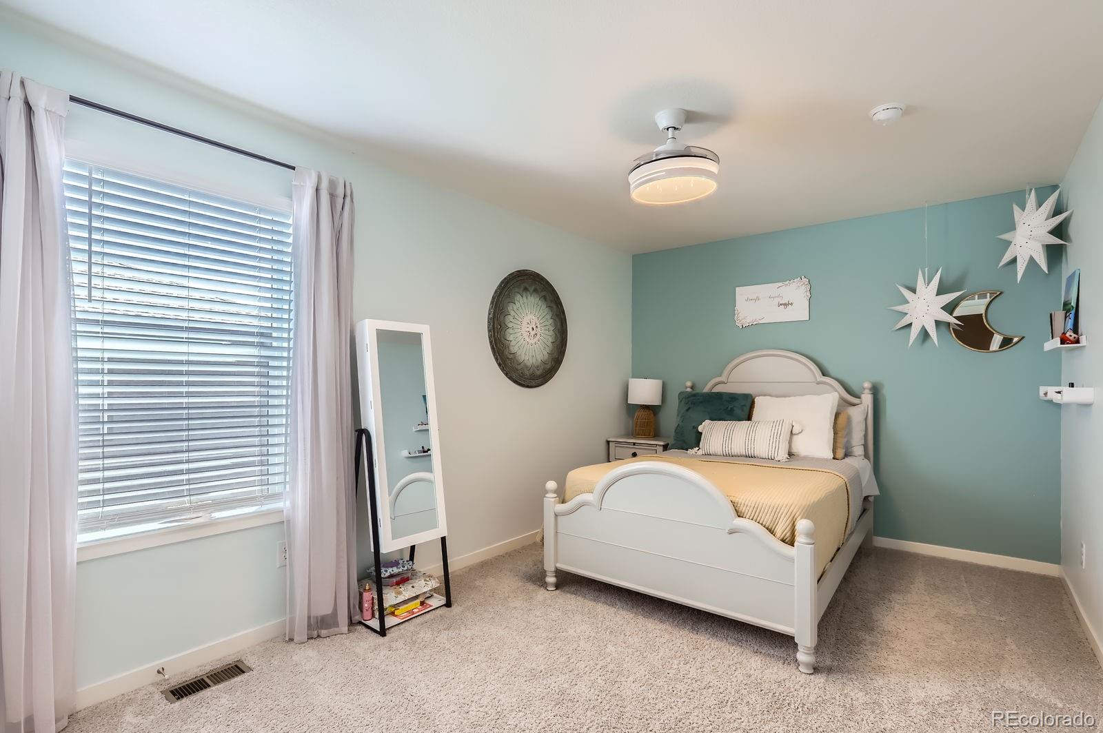 1591 Sun River Road Berthoud, CO 80513 - Photo 25 of 34 a bedroom with bed and a window