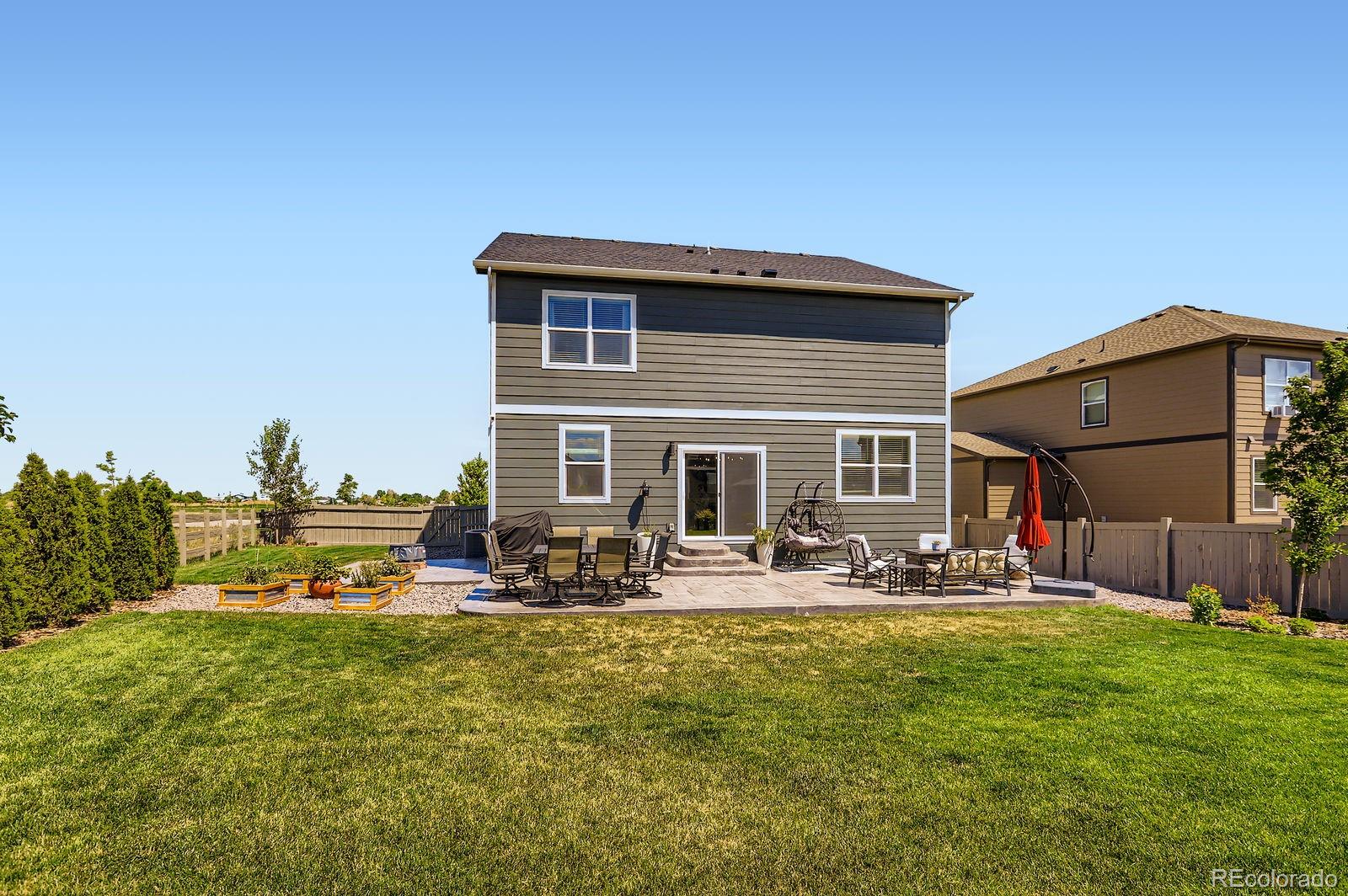 1591 Sun River Road Berthoud, CO 80513 - Photo 29 of 34 a front view of a house with patio
