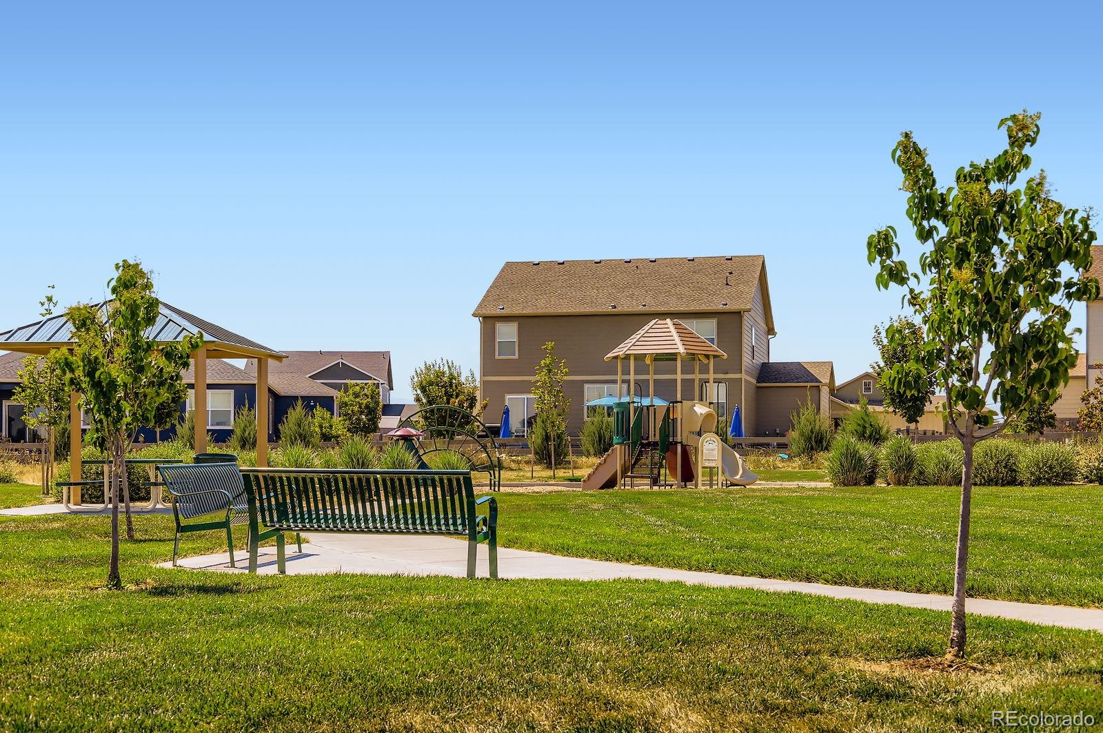1591 Sun River Road Berthoud, CO 80513 - Photo 34 of 34 a front view of a building with a yard