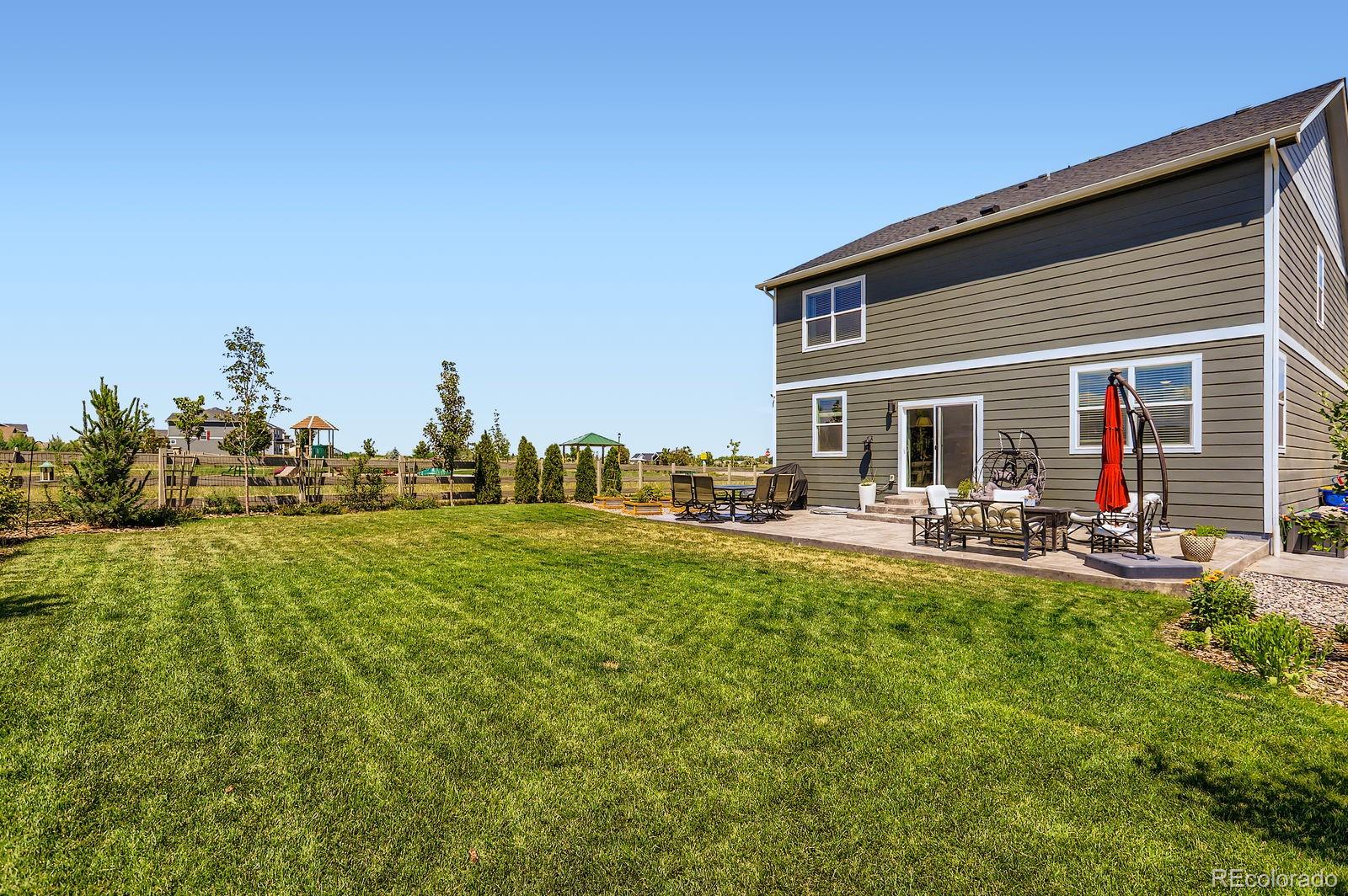 1591 Sun River Road Berthoud, CO 80513 - Photo 6 of 34 a view of a house with backyard porch and sitting area