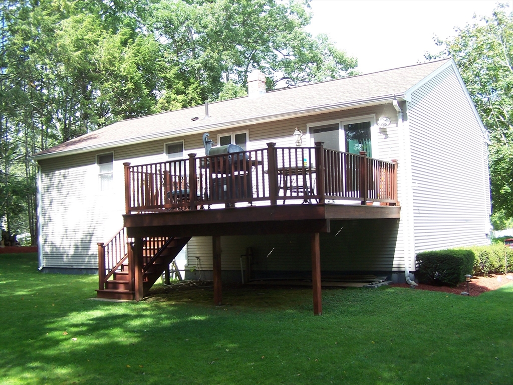 94 Lower Gore Road Webster, MA 01570 - Photo 3 of 19 a view of a house with a yard and a deck