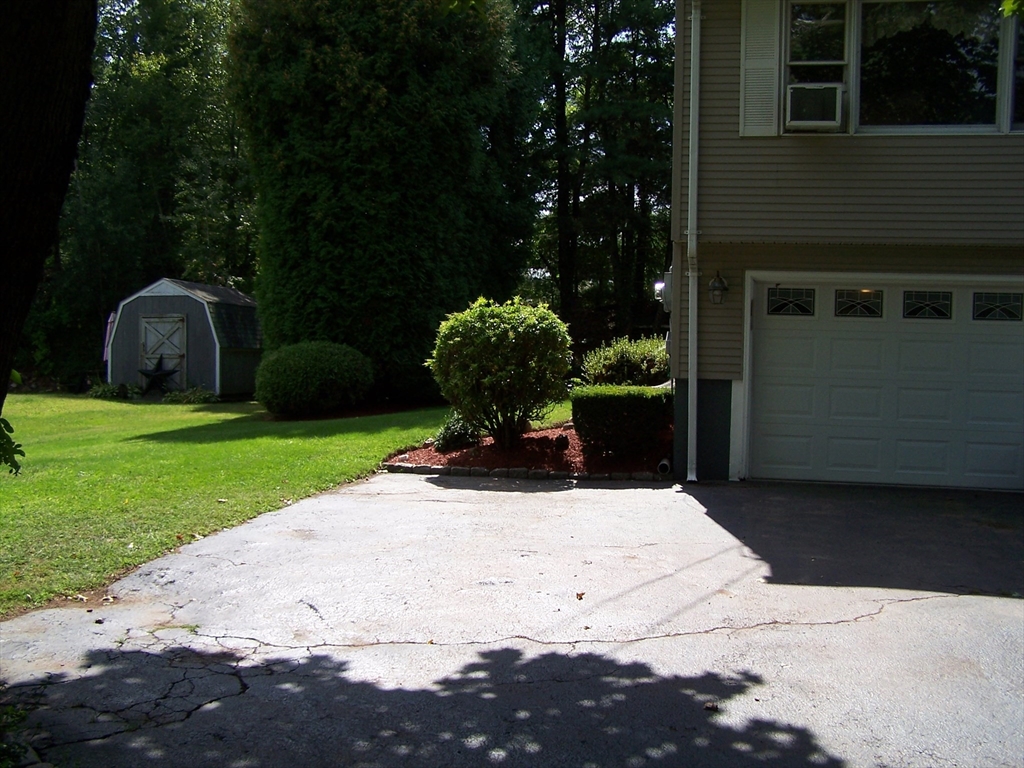 94 Lower Gore Road Webster, MA 01570 - Photo 8 of 19 a view of a backyard with sitting area