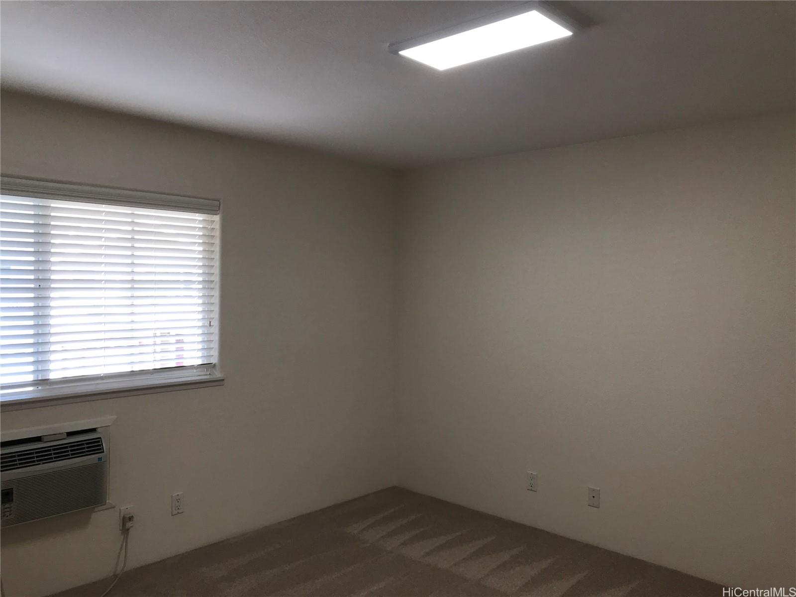7150 Hawaii Kai Drive, Unit 202 Honolulu, HI 96825 - Photo 11 of 14 an empty room with a window