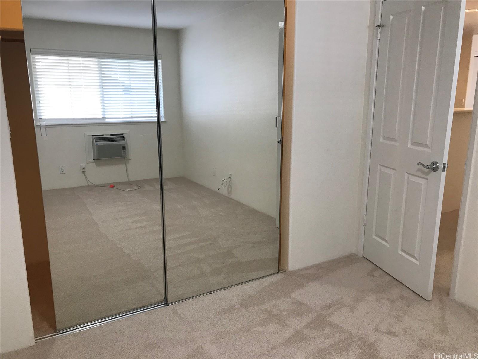 7150 Hawaii Kai Drive, Unit 202 Honolulu, HI 96825 - Photo 12 of 14 an empty room with window