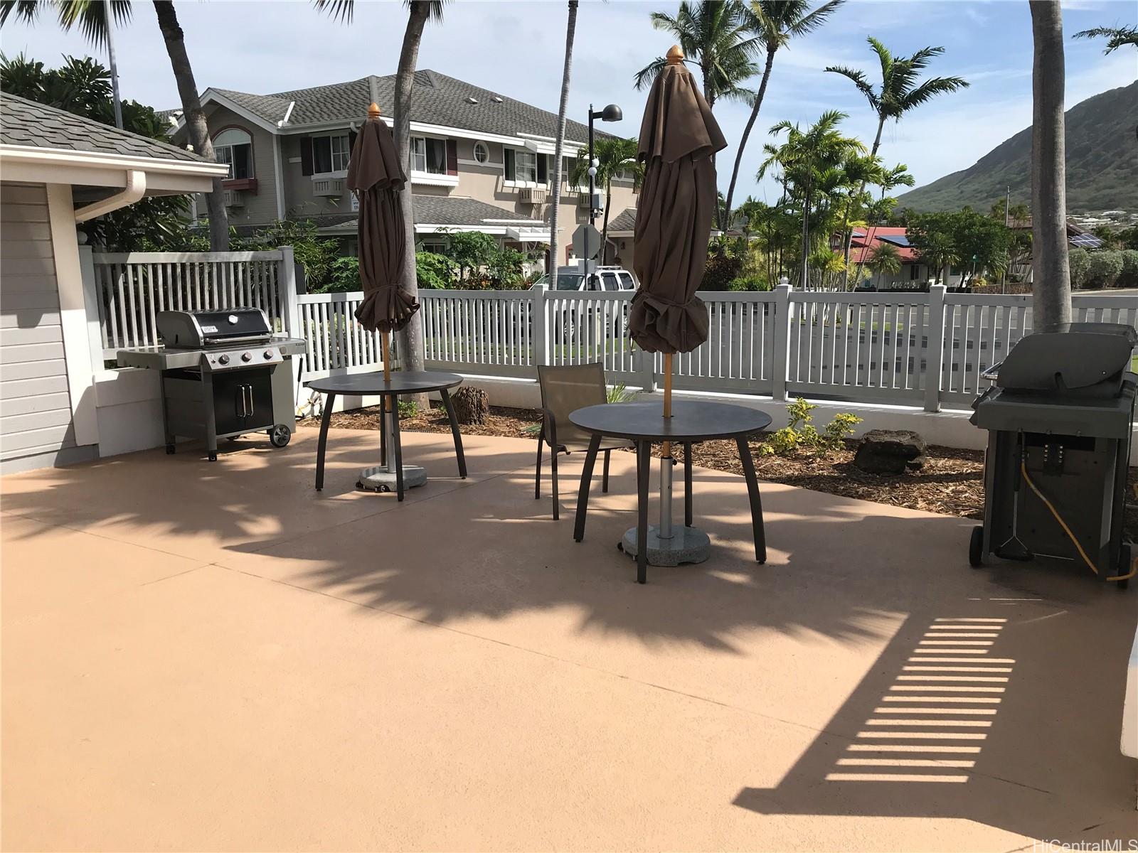 7150 Hawaii Kai Drive, Unit 202 Honolulu, HI 96825 - Photo 14 of 14 a view of a patio with a table chairs and a barbeque