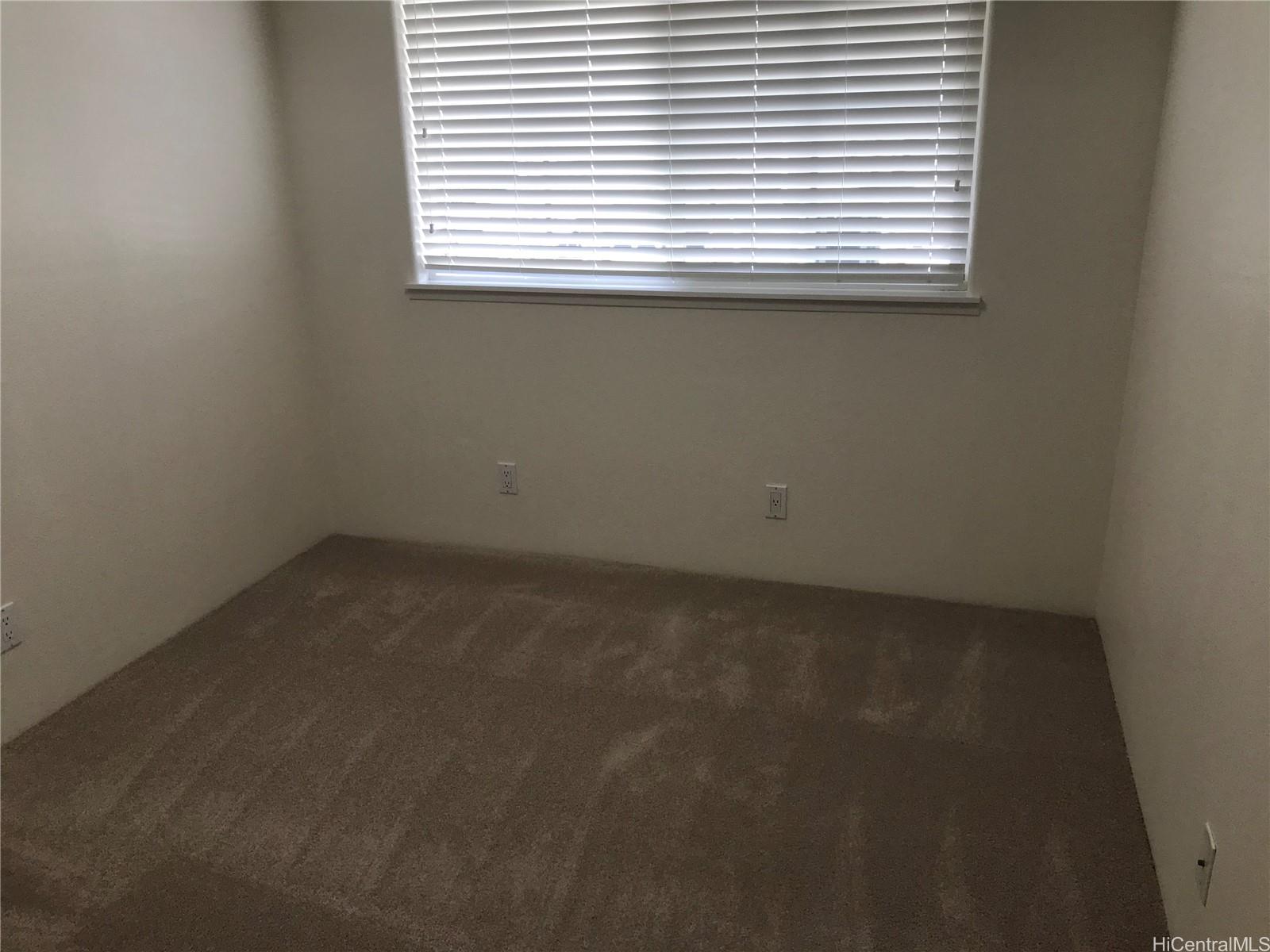 7150 Hawaii Kai Drive, Unit 202 Honolulu, HI 96825 - Photo 9 of 14 an empty room with a window