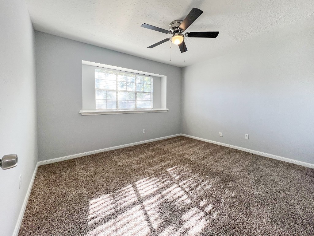 9206 Sharpview Drive Houston, TX 77036 - Photo 21 of 27 an empty room with a window