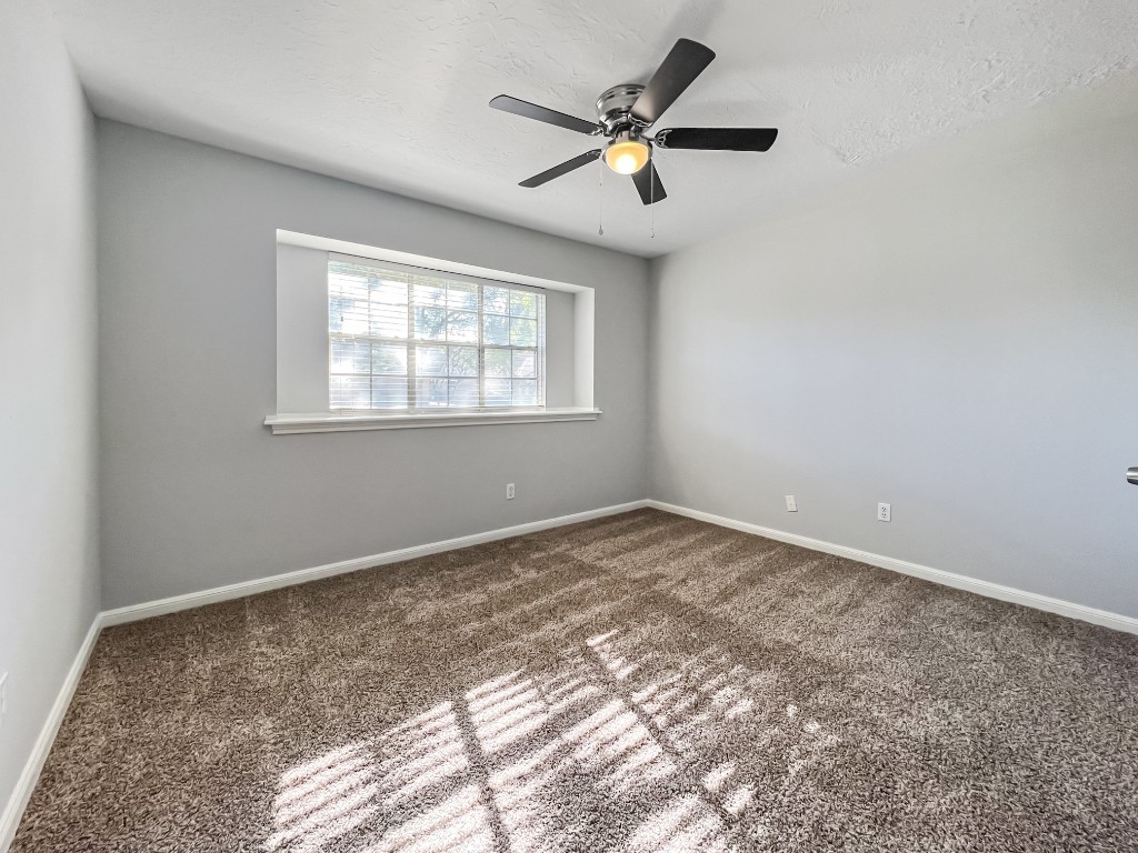 9206 Sharpview Drive Houston, TX 77036 - Photo 22 of 27 an empty room with a window