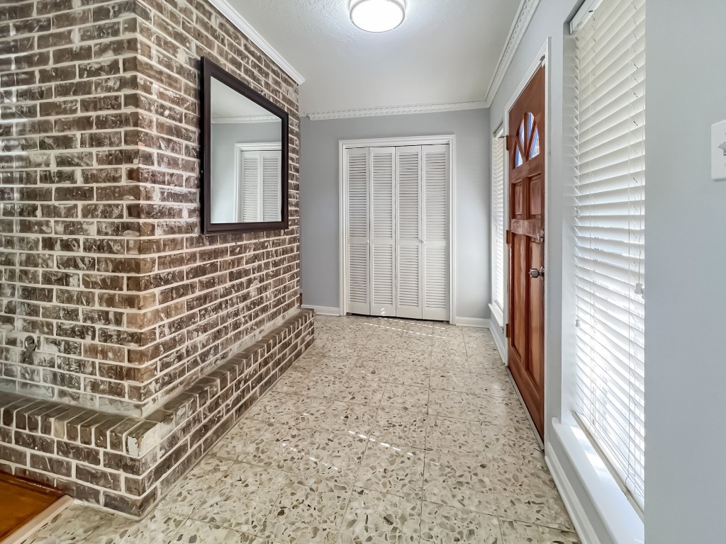 9206 Sharpview Drive Houston, TX 77036 - Photo 7 of 27 a view of a brick house with an empty space and balcony