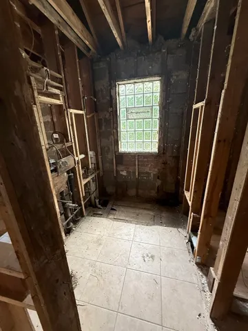 a view of walk in closet with clothes