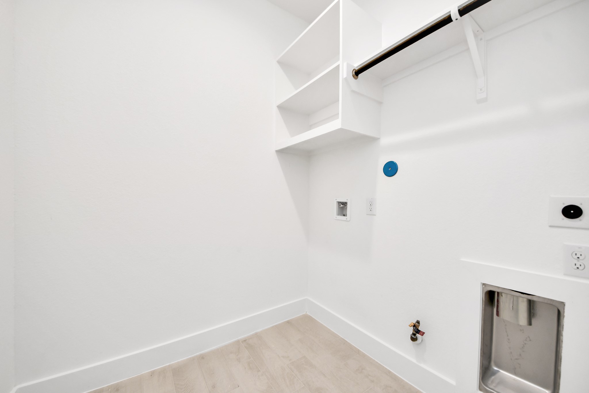 3102 Native Spg Drive Spring, TX 77373 - Photo 42 of 47 A perfect blend of functionality and comfort. Capture the essence of easy living with a first-floor laundry room, thoughtfully equipped with shelving for effortless organization. Both electric and gas connections available.