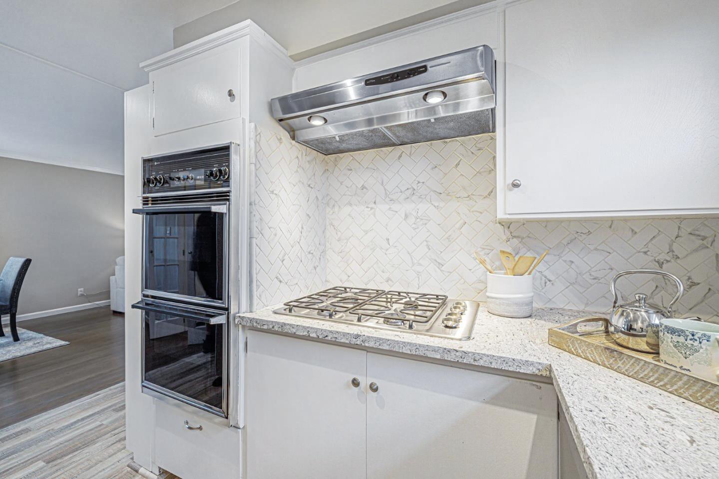 374 Bancroft Way Pacifica, CA 94044 - Photo 11 of 23 a kitchen with a refrigerator and a stove