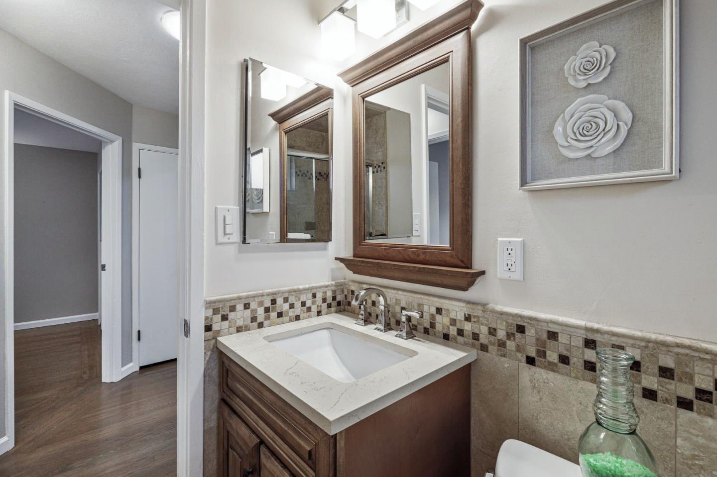 374 Bancroft Way Pacifica, CA 94044 - Photo 16 of 23 a bathroom with a sink and a mirror