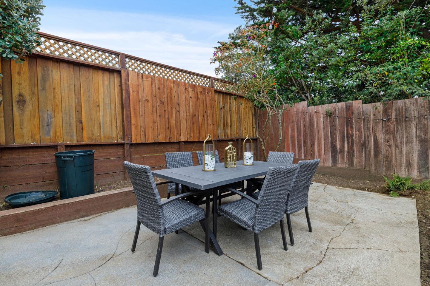 374 Bancroft Way Pacifica, CA 94044 - Photo 22 of 23 a backyard of a house with table and chairs