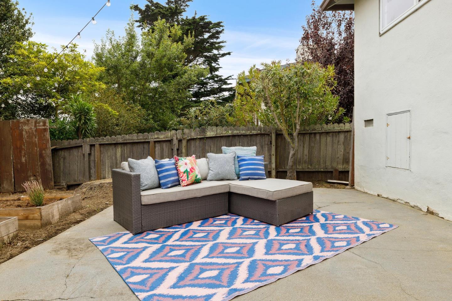 374 Bancroft Way Pacifica, CA 94044 - Photo 23 of 23 a view of a roof deck with couches and potted plants