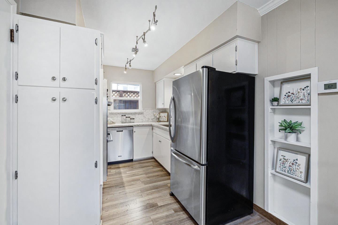 374 Bancroft Way Pacifica, CA 94044 - Photo 7 of 23 a kitchen with stainless steel appliances a refrigerator and a refrigerator