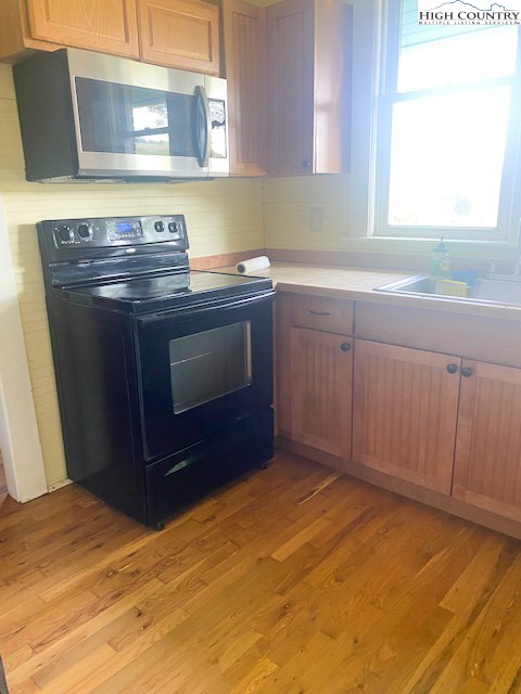 23 Millards Way Sparta, NC 28675 - Photo 17 of 46 a kitchen with a stove and a sink