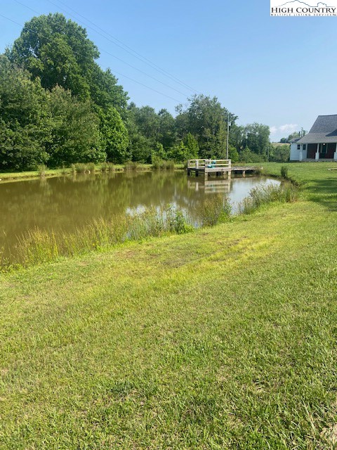 23 Millards Way Sparta, NC 28675 - Photo 19 of 46 a view of a lake with houses in the back