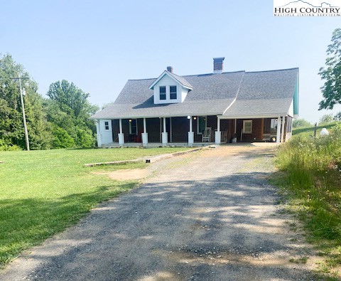 23 Millards Way Sparta, NC 28675 - Photo 2 of 46 a front view of a house with a yard