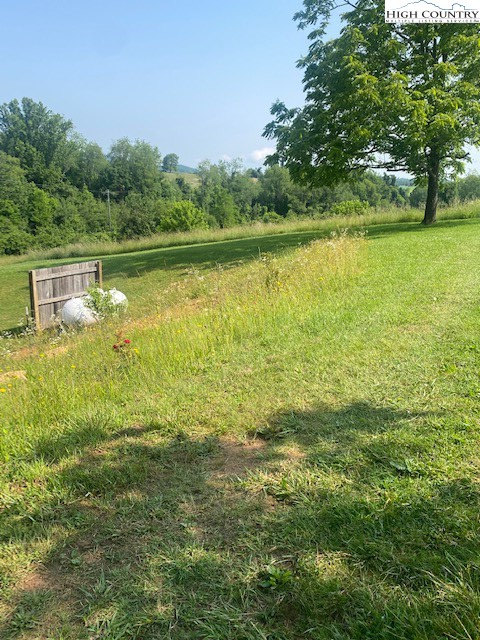 23 Millards Way Sparta, NC 28675 - Photo 21 of 46 a view of a lake with a yard