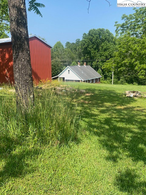 23 Millards Way Sparta, NC 28675 - Photo 30 of 46 a view of a table and chairs under an umbrella