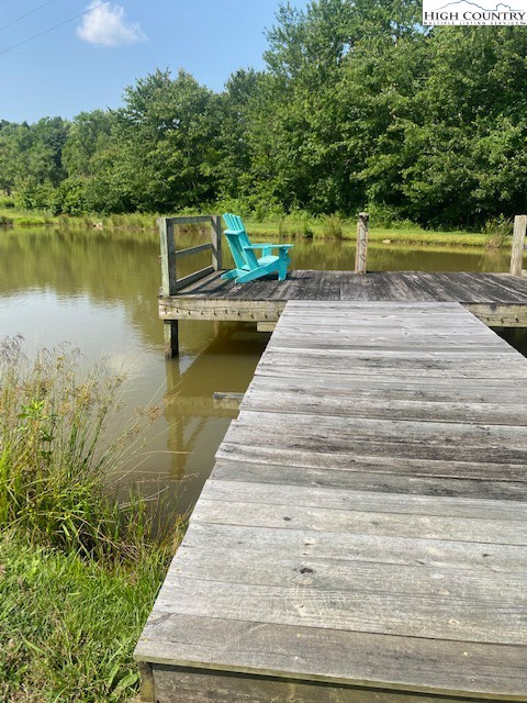 23 Millards Way Sparta, NC 28675 - Photo 3 of 46 a view of a lake with a yard