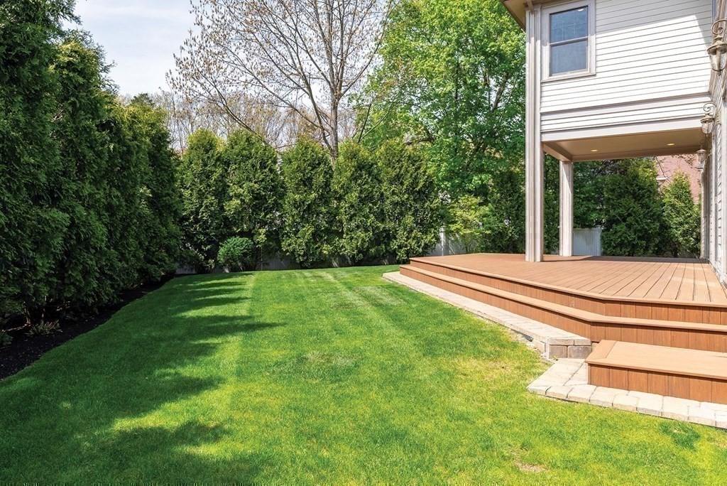53 Van Roosen Road Newton, MA 02459 - Photo 31 of 34 a view of a backyard with a garden