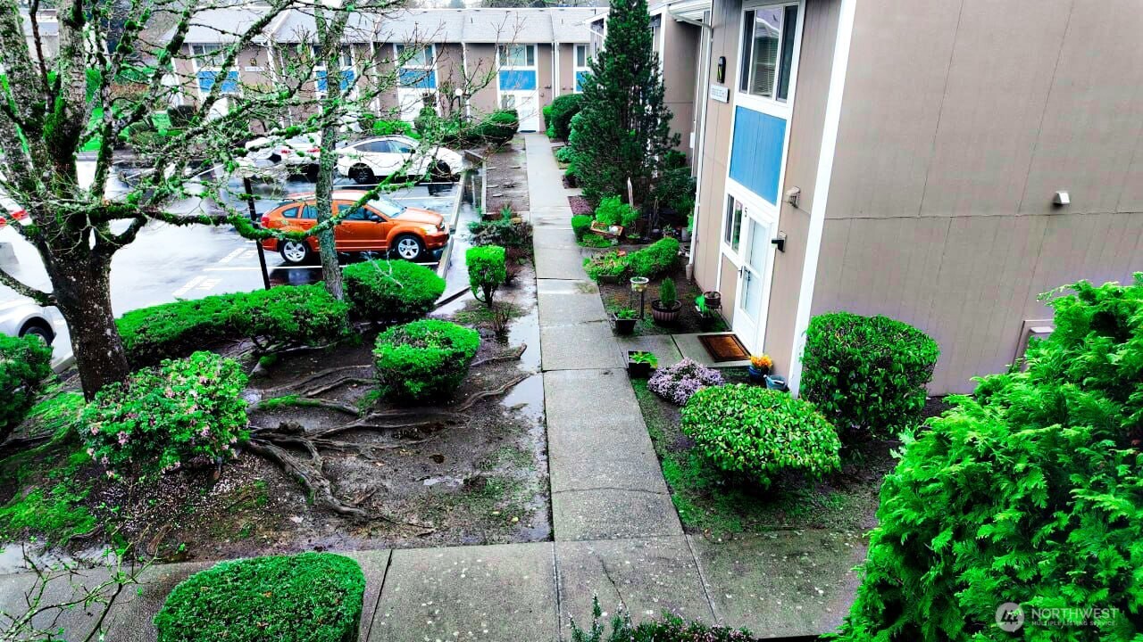 10601 Southeast 252nd Street, Unit O2 Kent, WA 98030 - Photo 15 of 18 an aerial view of a house with a yard and garden