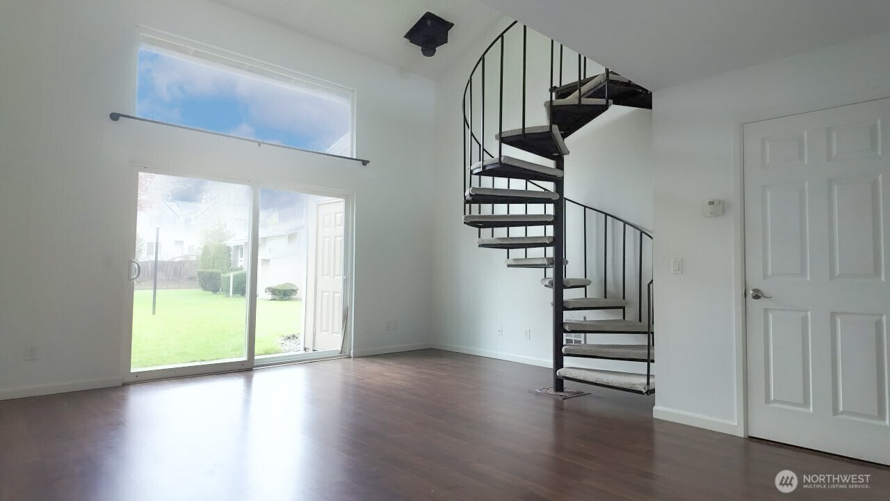 10601 Southeast 252nd Street, Unit O2 Kent, WA 98030 - Photo 3 of 18 a view of entryway with wooden floor and stairs