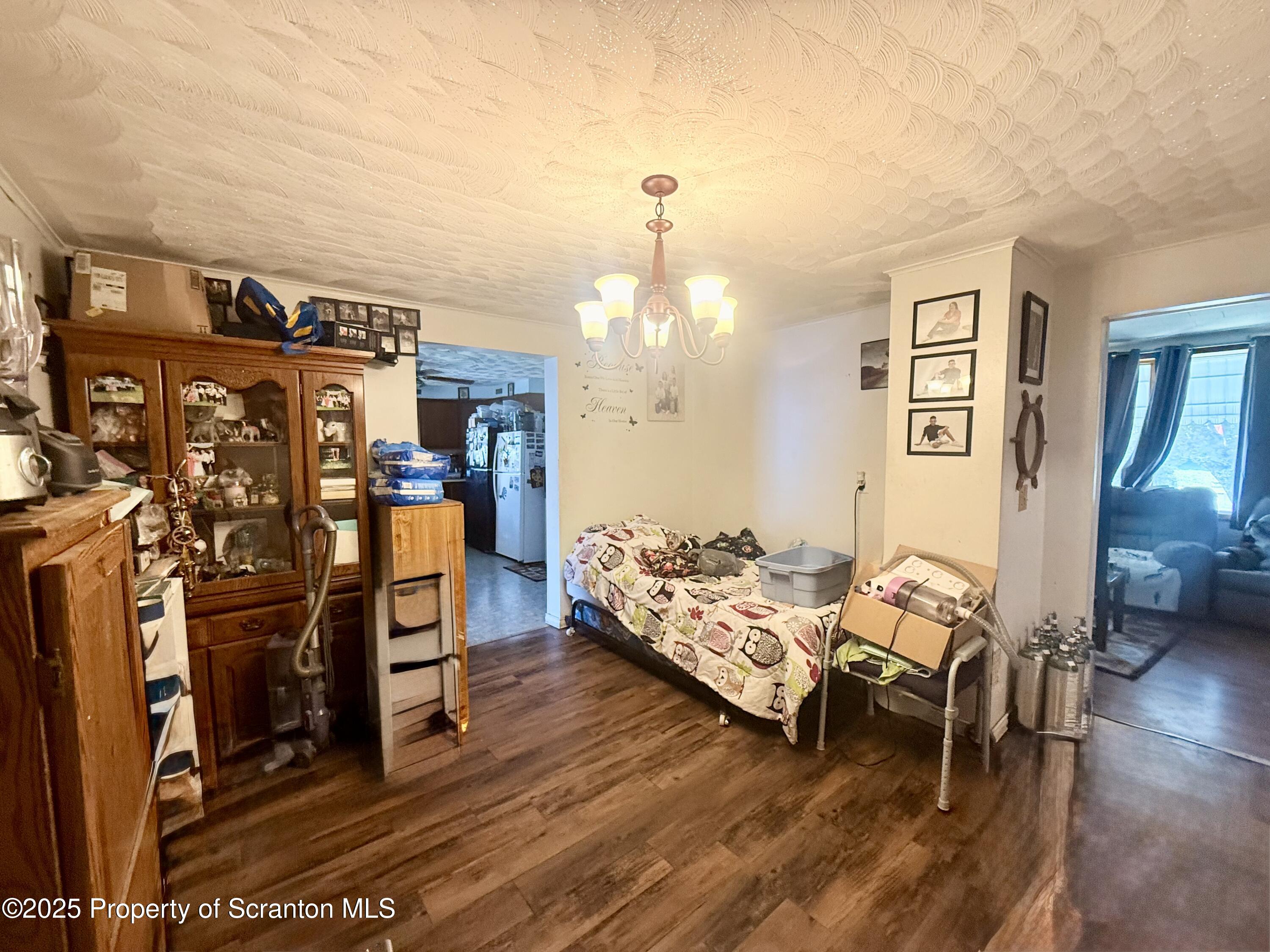 307 Charles Street Old Forge, PA 18518 - Photo 6 of 13 a living room with furniture a wooden floor and next to a window