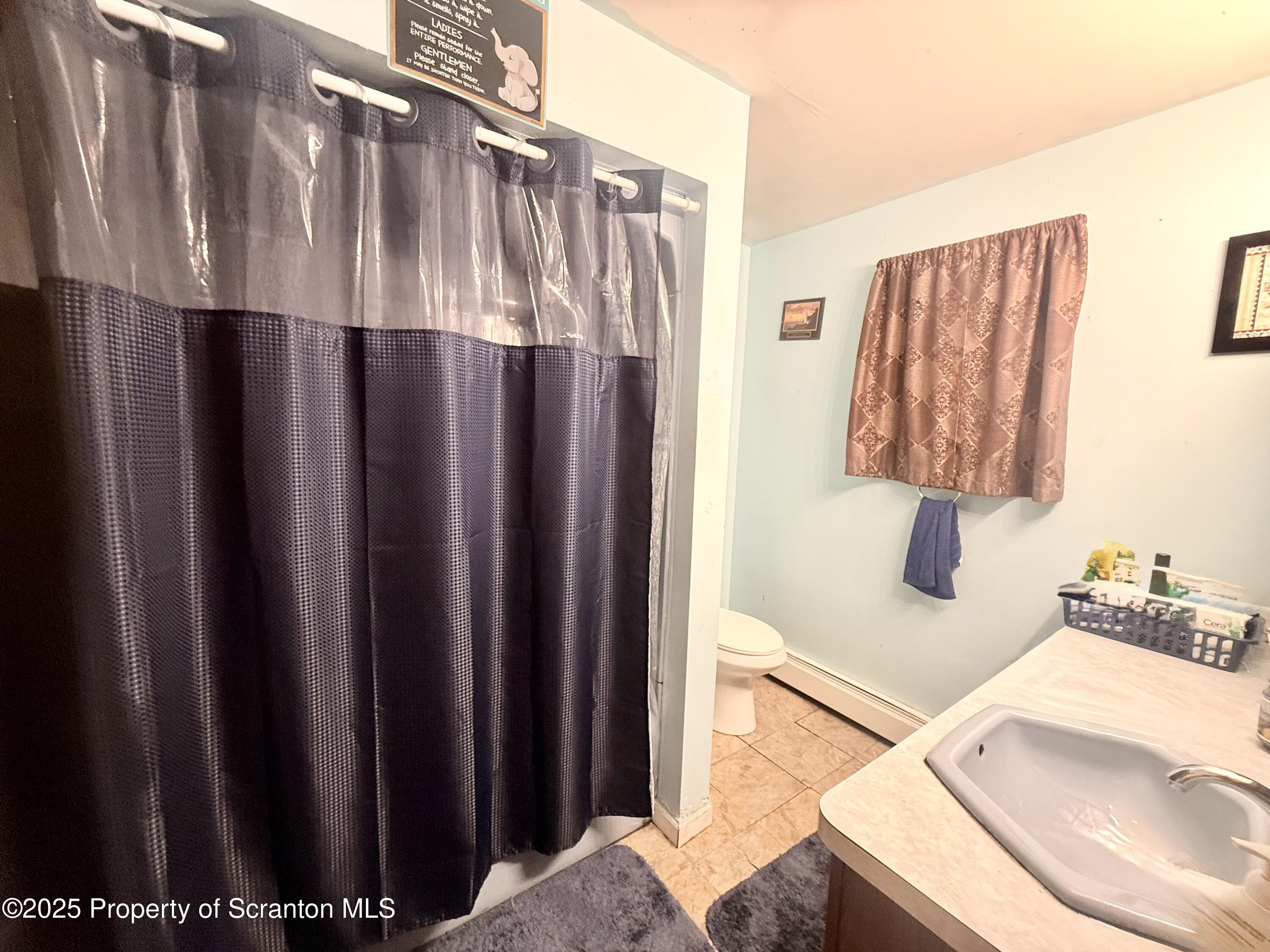 307 Charles Street Old Forge, PA 18518 - Photo 9 of 13 a view of walk in closet with clothes and shoes