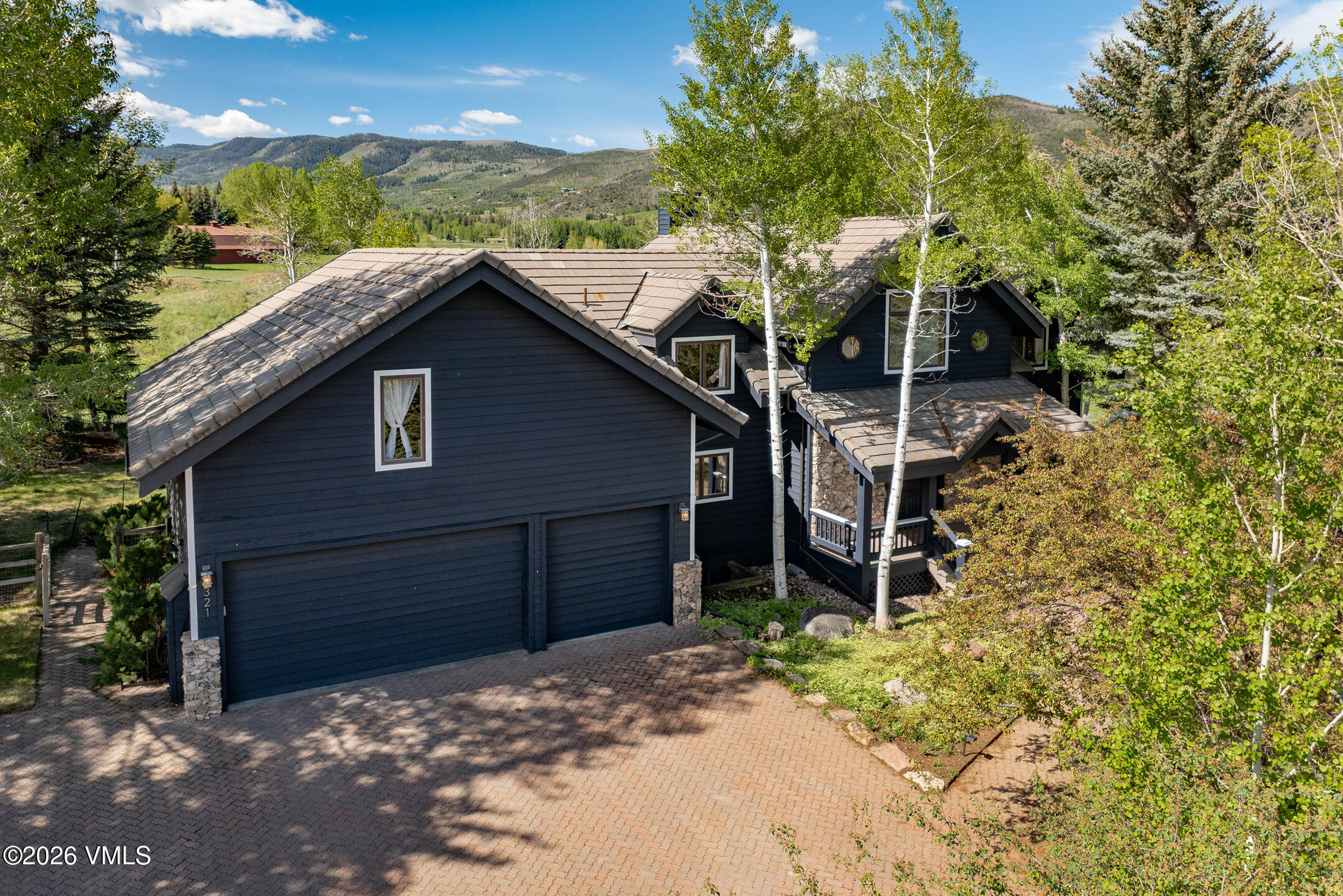 321 Meile Lane Edwards, CO 81632 - Photo 33 of 44 a house with trees in the background