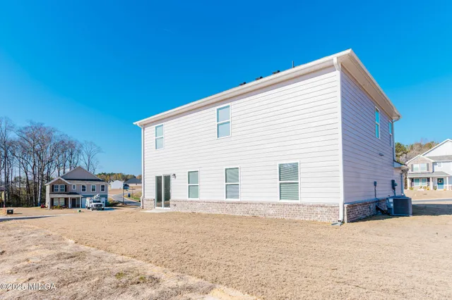 a view of a house with a snow in the yard