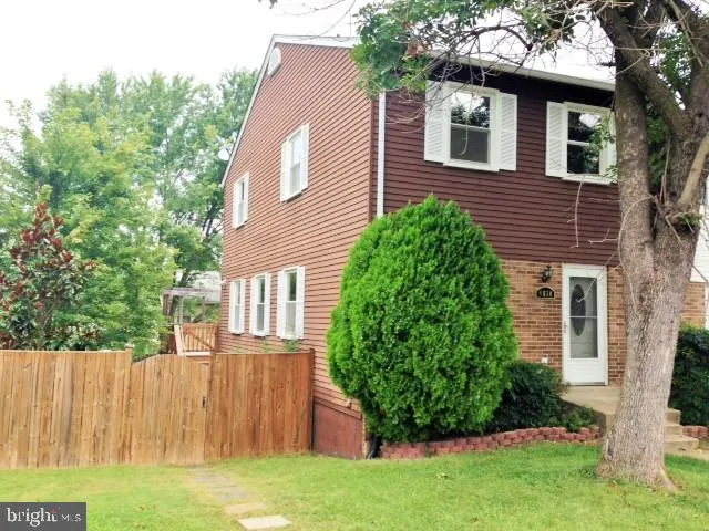 a view of a house with a yard and plants