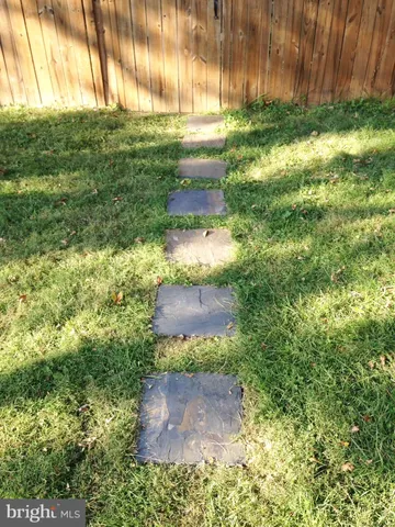 a kitchen with a stove top oven and sink