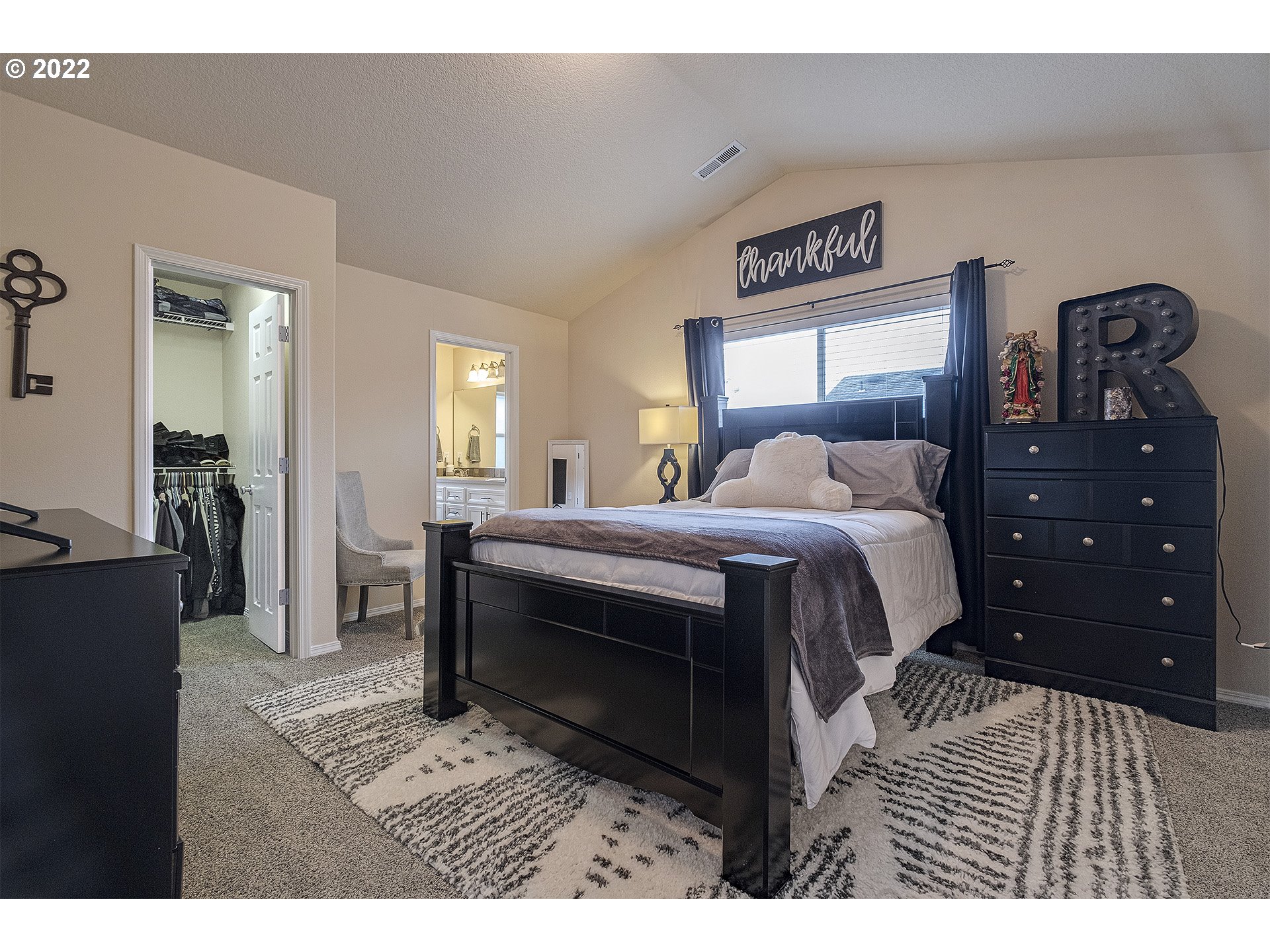 40348 Therese Street Sandy, OR 97055 - Photo 17 of 28 a bedroom with a bed and a mirror