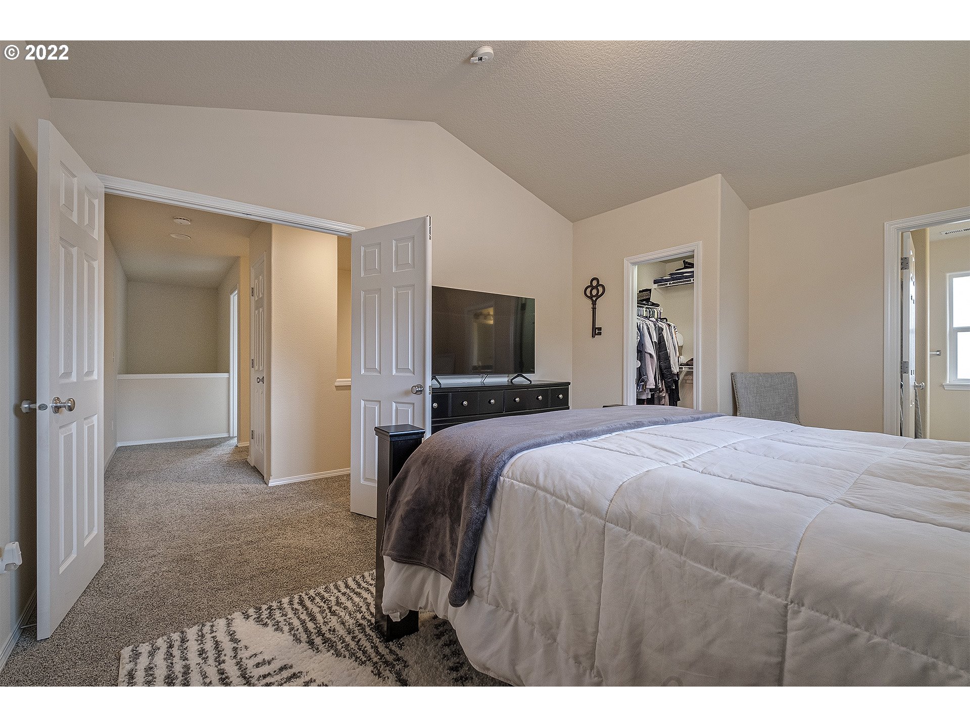 40348 Therese Street Sandy, OR 97055 - Photo 18 of 28 a bedroom with a bed and a flat screen tv