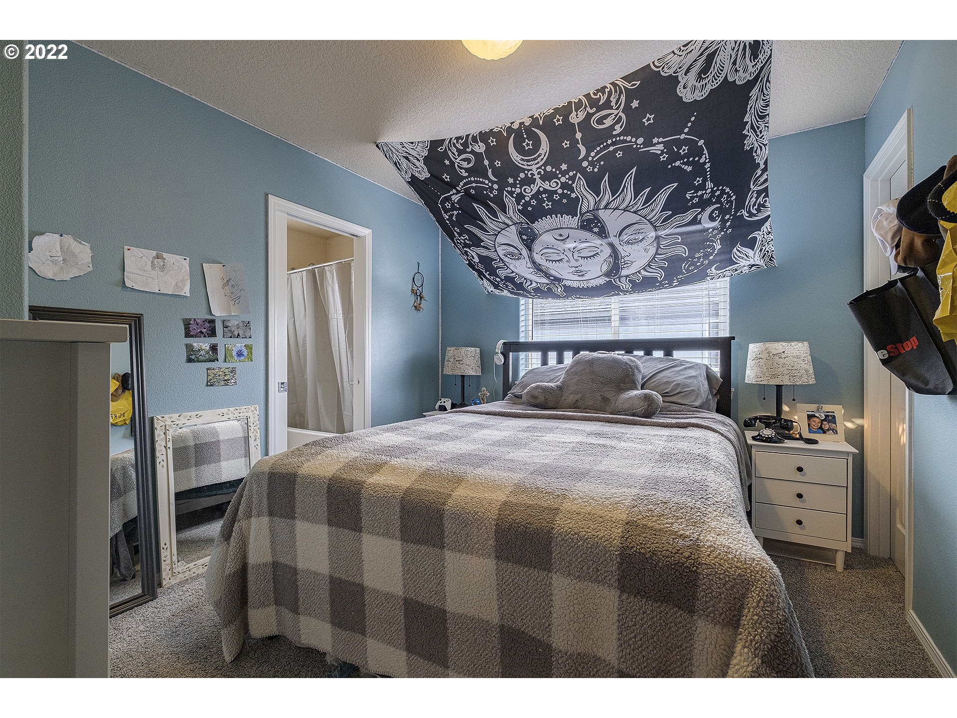 40348 Therese Street Sandy, OR 97055 - Photo 23 of 28 a bedroom with a bed and a chandelier