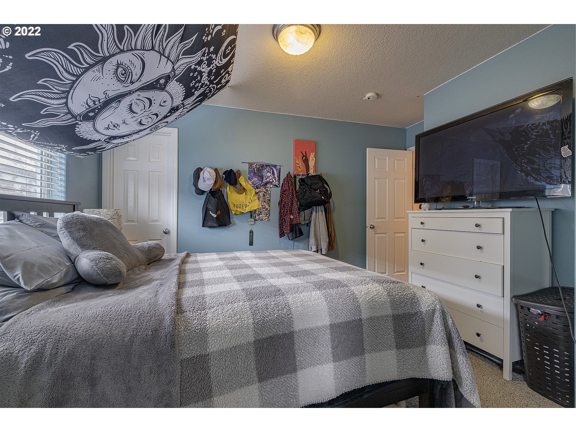 40348 Therese Street Sandy, OR 97055 - Photo 24 of 28 a bedroom with a bed and a television in it