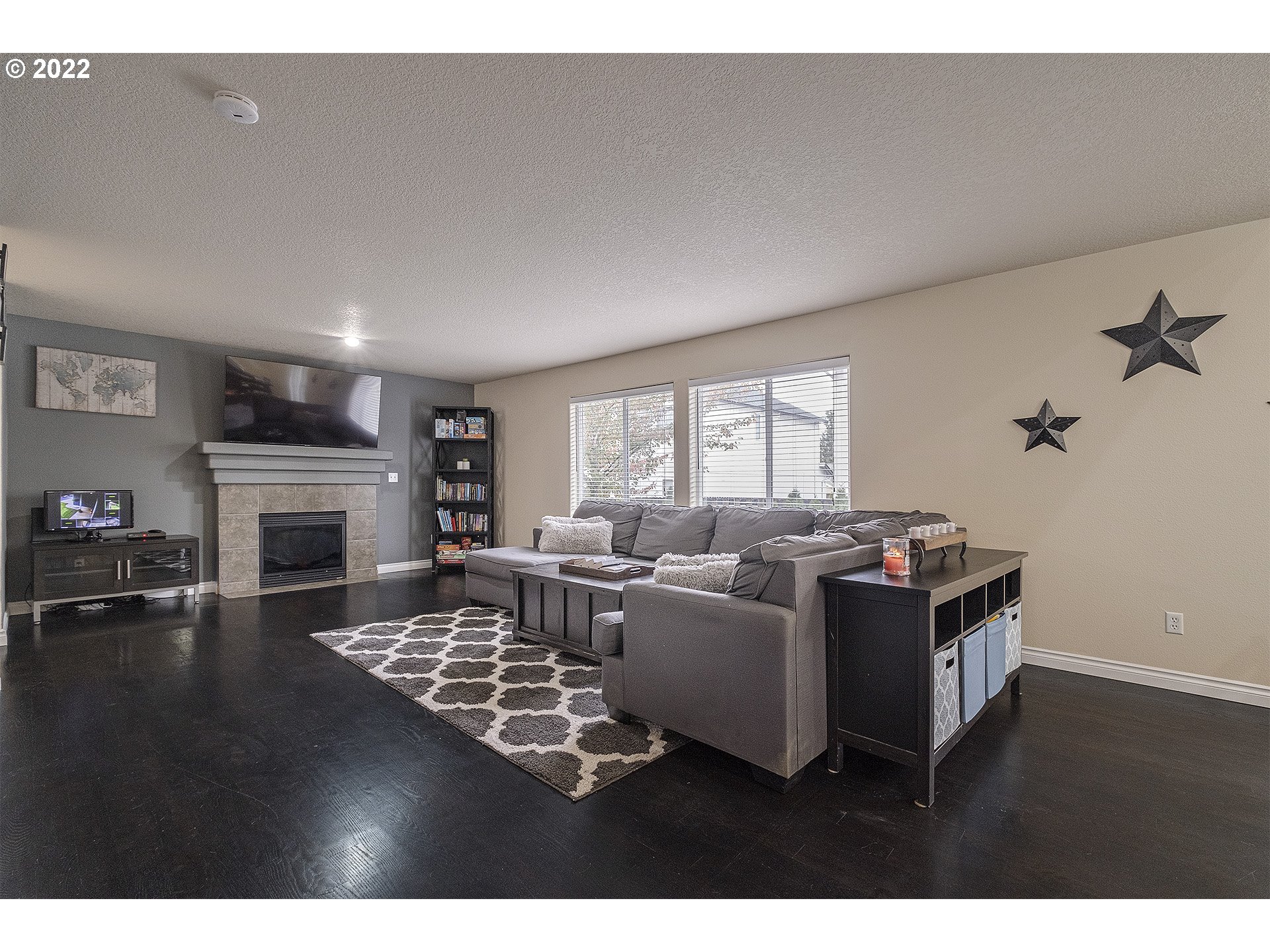 40348 Therese Street Sandy, OR 97055 - Photo 4 of 28 a living room with furniture large window and a fireplace