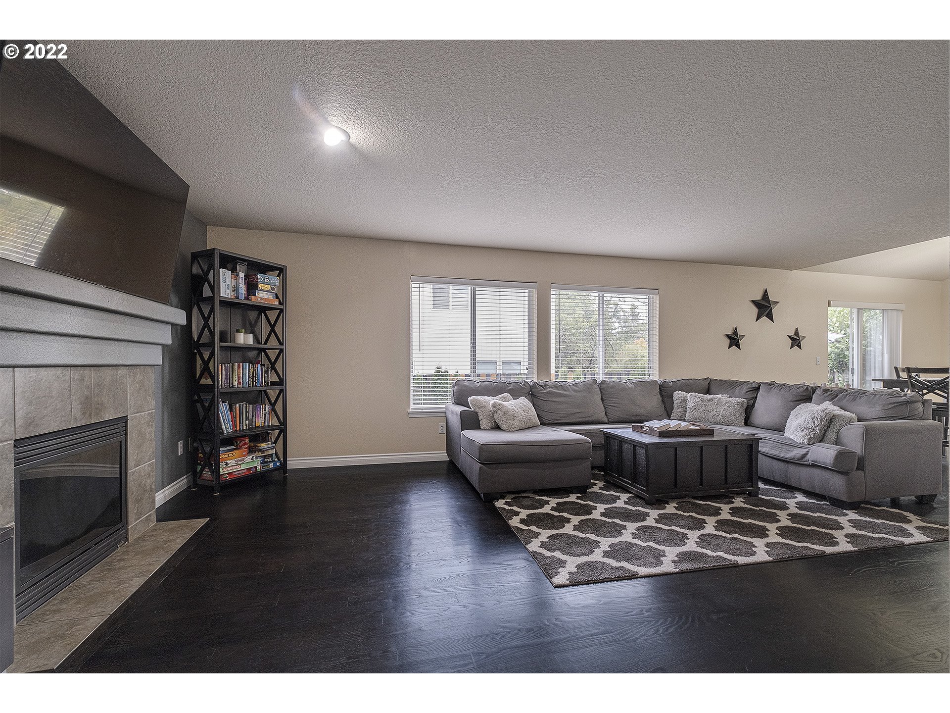 40348 Therese Street Sandy, OR 97055 - Photo 5 of 28 a living room with furniture wooden floor and a fireplace