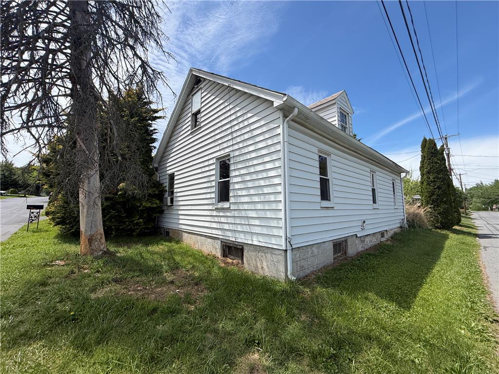 3051 Keystone Street Bethlehem, PA 18020 - Photo 4 of 18 A classic exterior with white siding and a dormer window awaits its next owner.