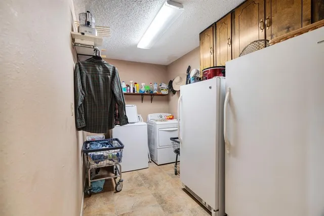 a white refrigerator freezer sitting inside of a kitchen