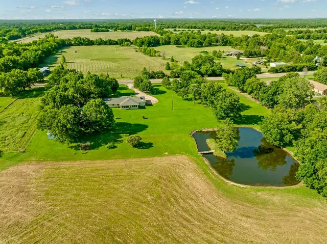 a view of a lake with a yard