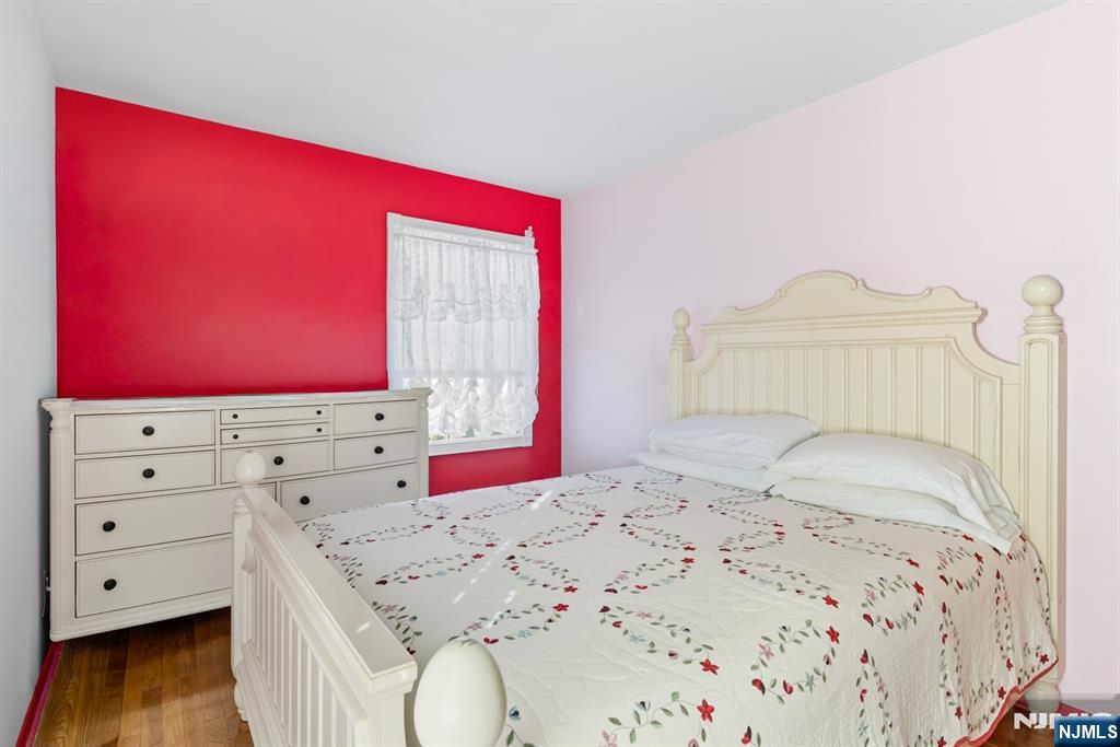 8 Lynn Boulevard Hazlet, NJ 07730 - Photo 14 of 25 a bedroom with a bed and a dresser