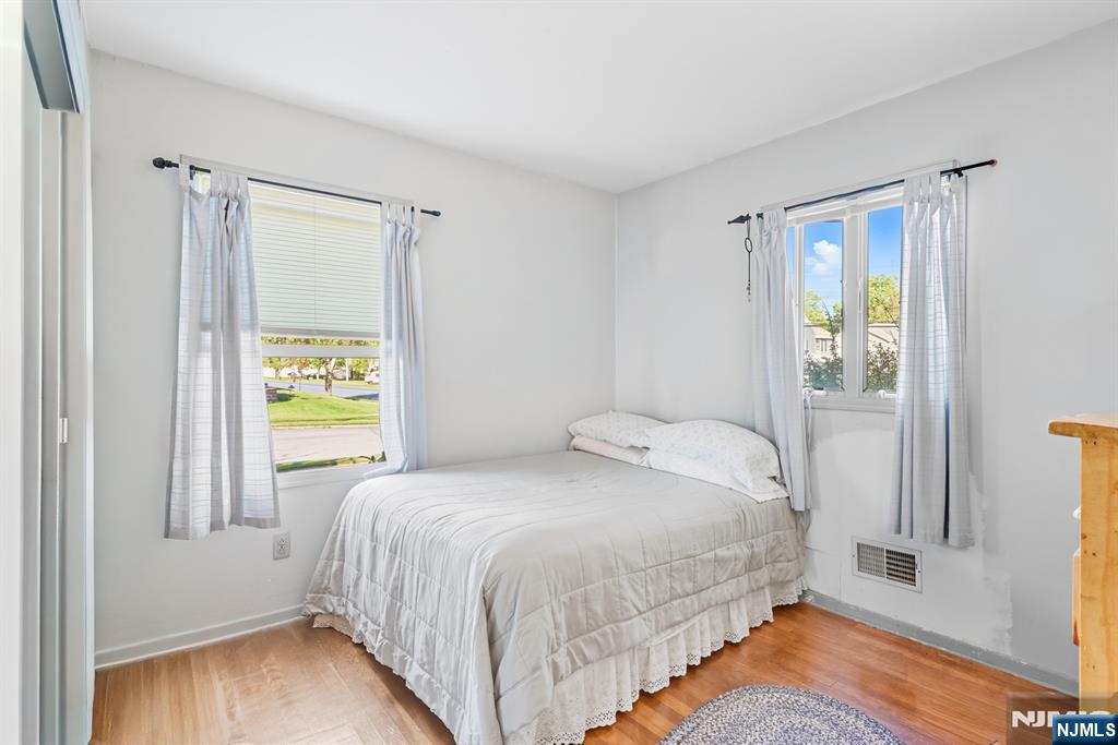 8 Lynn Boulevard Hazlet, NJ 07730 - Photo 17 of 25 a bedroom with a bed and a window